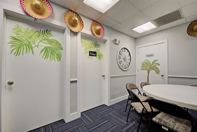 dining area with a drop ceiling