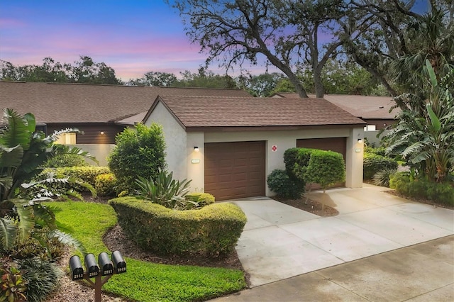 view of front of property with a garage