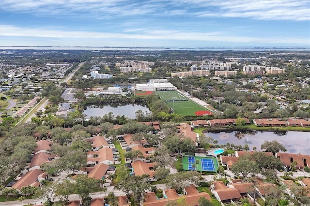 birds eye view of property with a water view