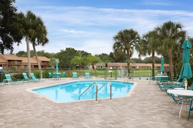 view of swimming pool featuring a patio area