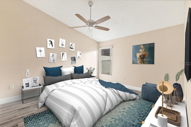 bedroom featuring hardwood / wood-style floors, ceiling fan, and lofted ceiling