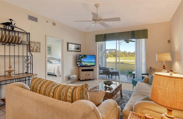 tiled living room with ceiling fan