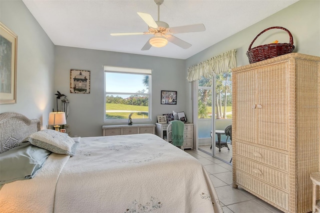 8755 Olde Hickory Ave Unit 7101, Sarasota, FL 34238 - bedroom featuring multiple windows, light tile patterned flooring, access to outside, and radiator heating unit