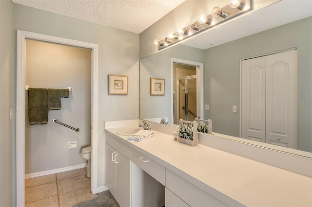 8755 Olde Hickory Ave Unit 7101, Sarasota, FL 34238 - bathroom with vanity, tile patterned floors, a stall shower, and a textured ceiling