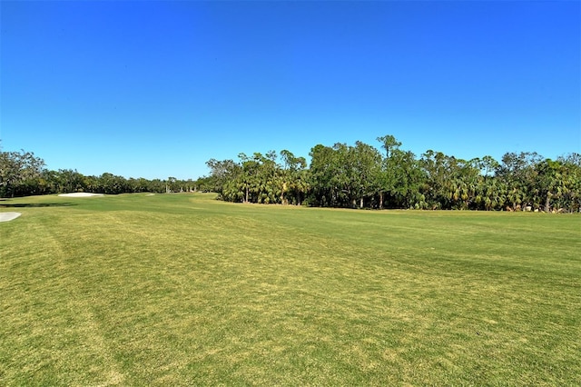 8755 Olde Hickory Ave Unit 7101, Sarasota, FL 34238 - view of community featuring golf course view, view of scattered trees, and a lawn