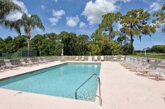 8755 Olde Hickory Ave Unit 7101, Sarasota, FL 34238 - community pool featuring a patio and view of wooded area