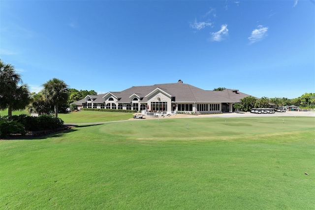 8755 Olde Hickory Ave Unit 7101, Sarasota, FL 34238 - view of community with view of golf course, an area to practice putting, and a yard