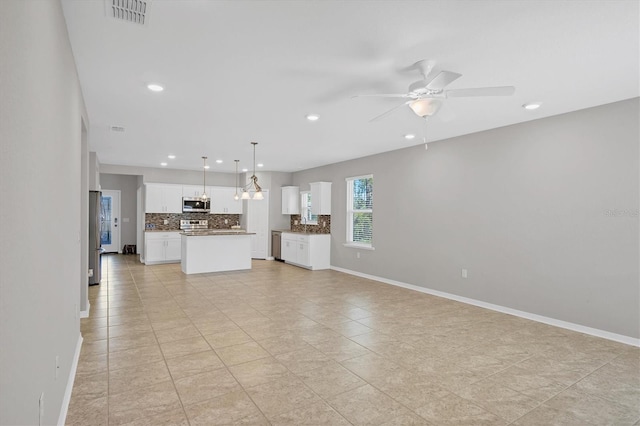 unfurnished living room with ceiling fan and light tile patterned floors