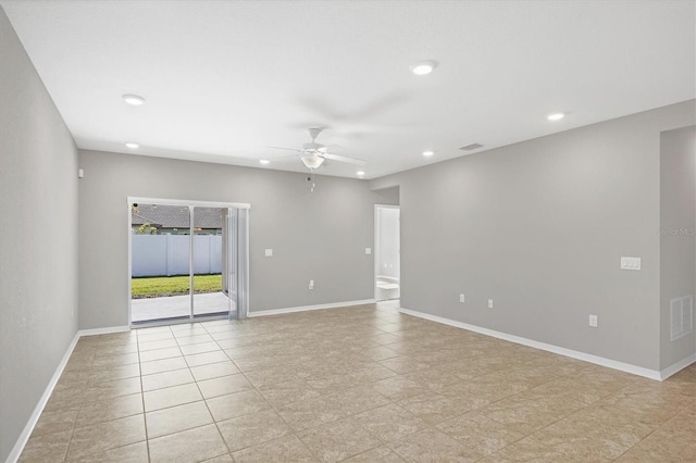 unfurnished room with light tile patterned floors and ceiling fan