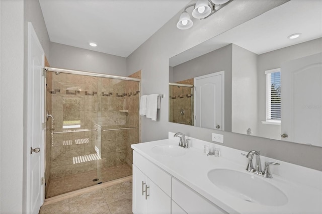 bathroom with vanity, tile patterned floors, and walk in shower