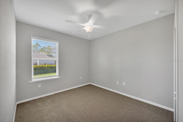 carpeted empty room with ceiling fan