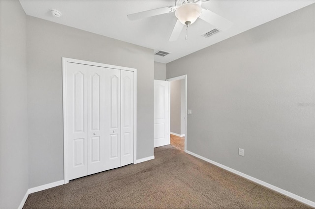 unfurnished bedroom with carpet floors, a closet, and ceiling fan