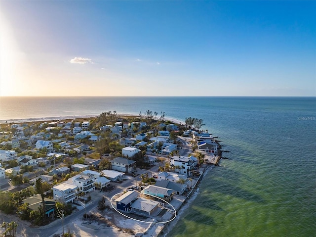 aerial view at dusk with a water view