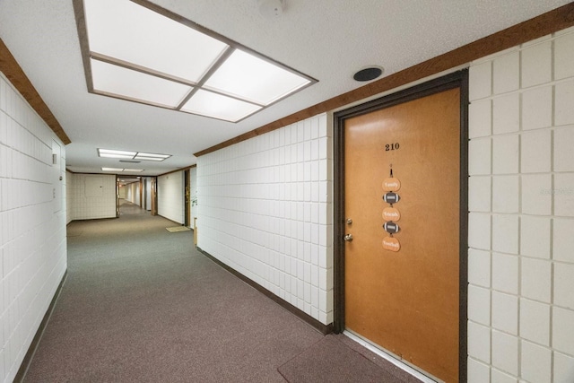 corridor with dark carpet