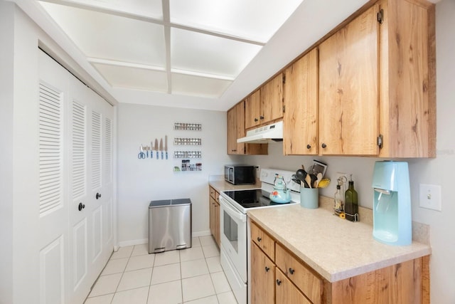 kitchen featuring white range with electric cooktop and light tile patterned flooring