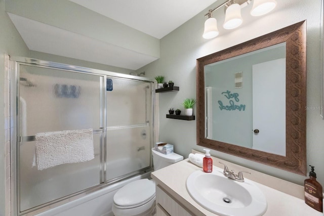 full bathroom with toilet, vanity, and combined bath / shower with glass door