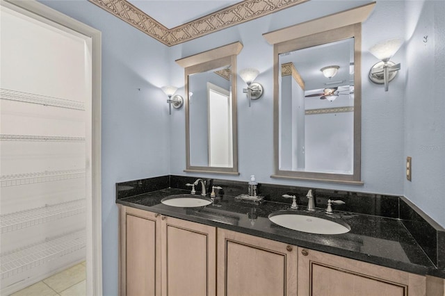 bathroom with tile patterned floors, ceiling fan, and vanity