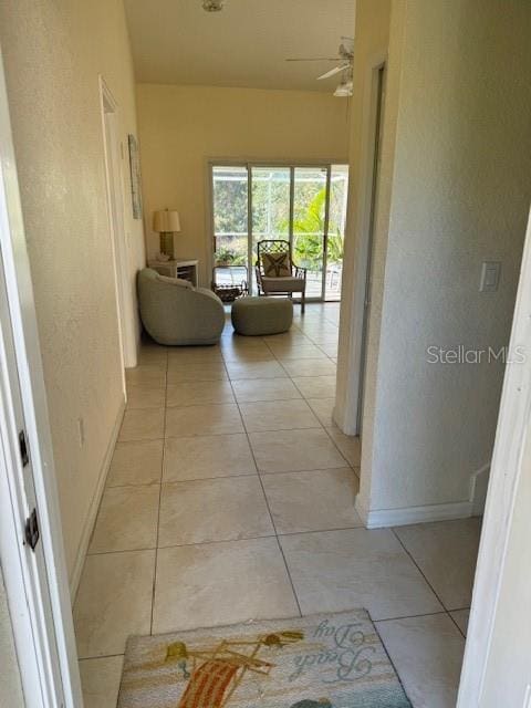 hallway featuring light tile patterned floors