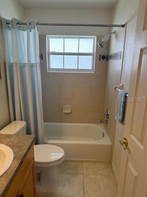 full bathroom featuring tile patterned flooring, vanity, shower / bath combination with curtain, and toilet