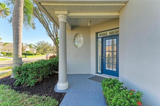 property entrance with covered porch