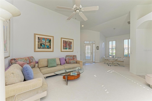 living room with light carpet, vaulted ceiling, and ceiling fan