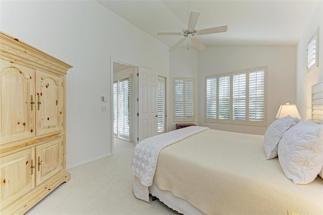 carpeted bedroom with ceiling fan and lofted ceiling