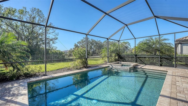 view of pool with a lanai, an in ground hot tub, and a patio