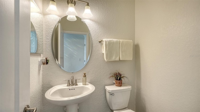 bathroom with sink and toilet