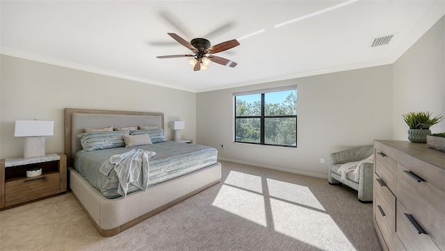 bedroom featuring light carpet, ceiling fan, and crown molding