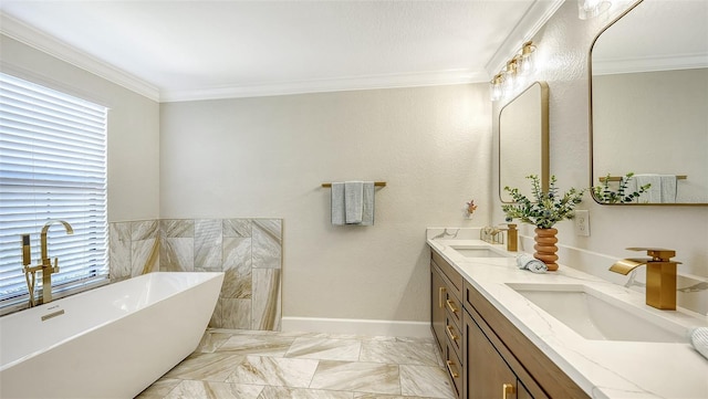 bathroom featuring a washtub, crown molding, and vanity