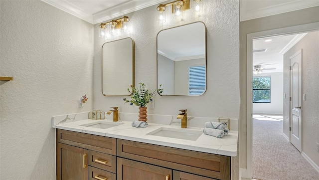 bathroom with vanity, ceiling fan, and crown molding