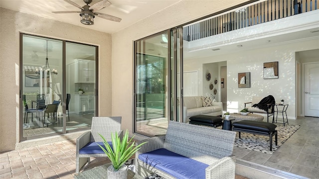 view of patio featuring ceiling fan