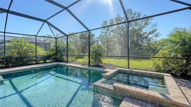 view of pool with an in ground hot tub