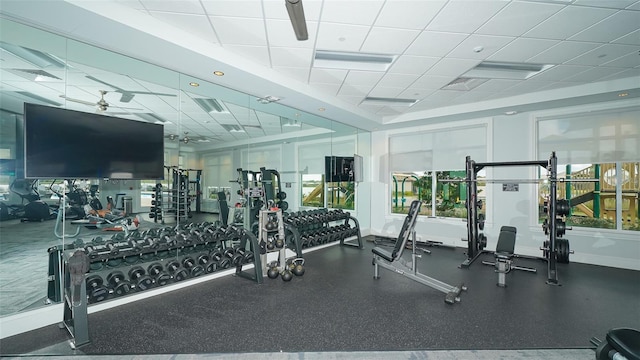 exercise room with a paneled ceiling