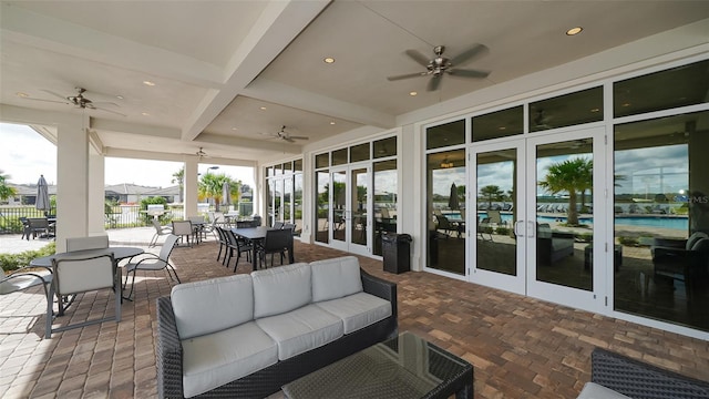 view of patio / terrace with ceiling fan, an outdoor hangout area, and french doors