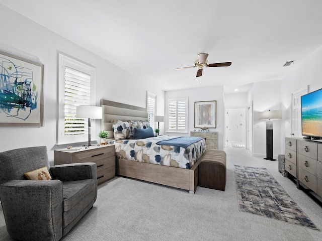 carpeted bedroom with ceiling fan