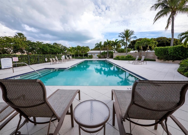 view of swimming pool with a patio area