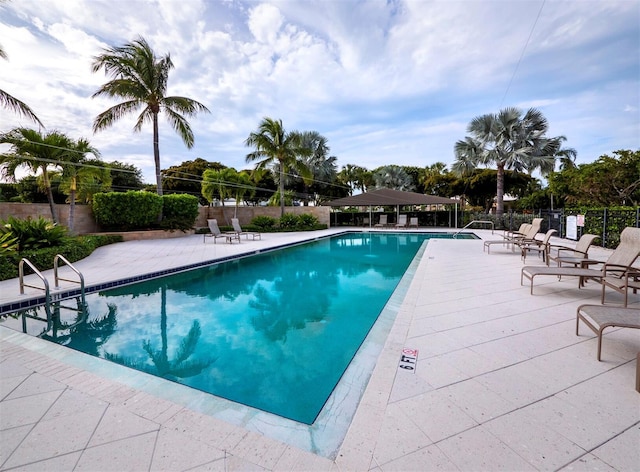 view of swimming pool featuring a patio area