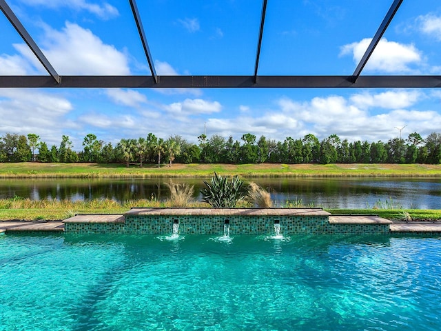 view of pool featuring pool water feature, glass enclosure, and a water view