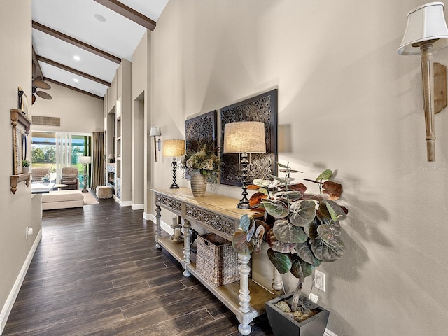 corridor featuring dark hardwood / wood-style floors, beam ceiling, and high vaulted ceiling