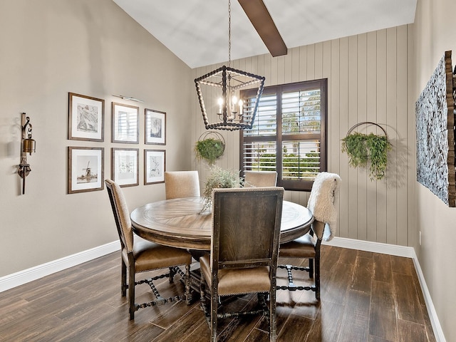 dining space featuring lofted ceiling, dark wood-type flooring, and a chandelier