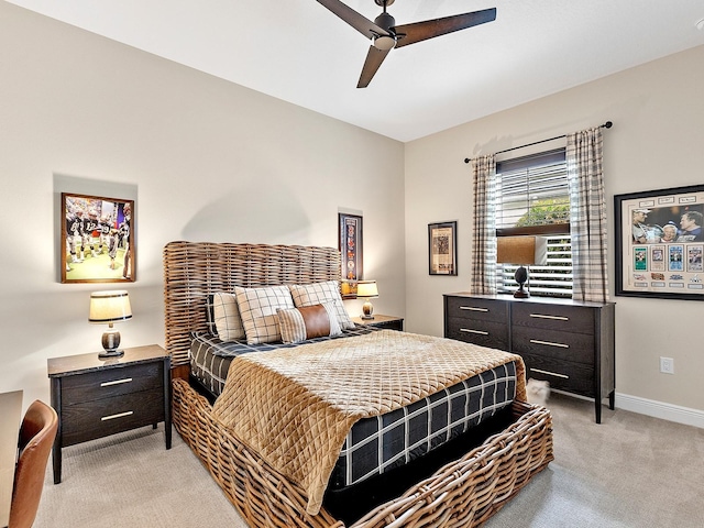 bedroom with ceiling fan and light carpet