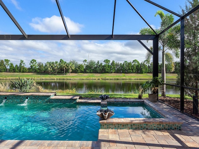 view of pool with pool water feature, glass enclosure, and a water view