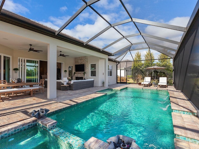 view of pool with an outdoor hangout area, pool water feature, ceiling fan, a lanai, and a patio area