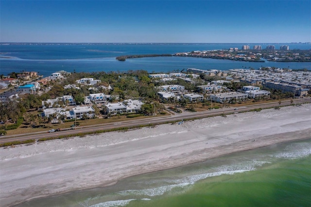 bird's eye view featuring a water view and a view of the beach