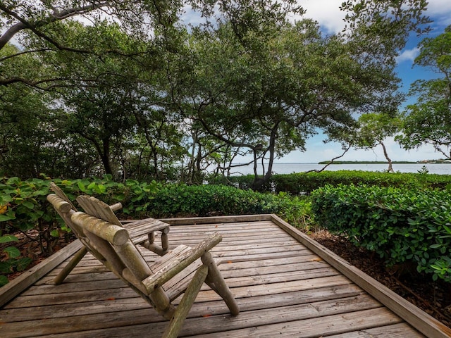 wooden terrace with a water view