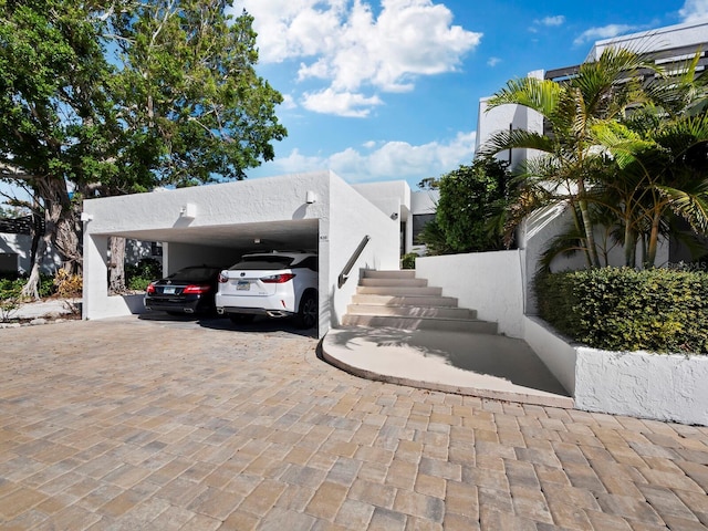 view of property exterior featuring a carport