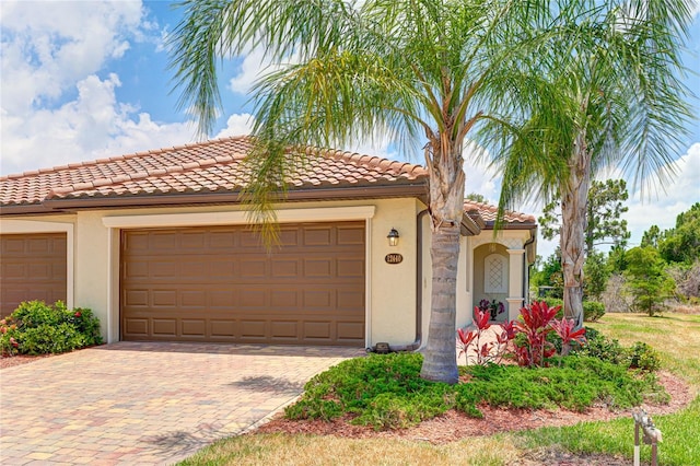 mediterranean / spanish house featuring a garage