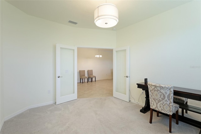 carpeted office featuring french doors