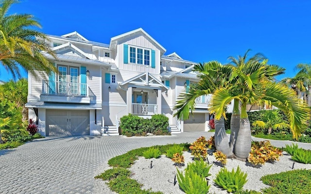 view of front of home featuring covered porch and a garage